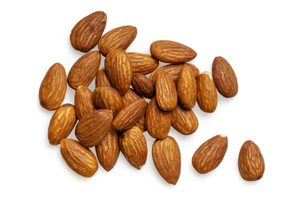 brown almond nuts on white background